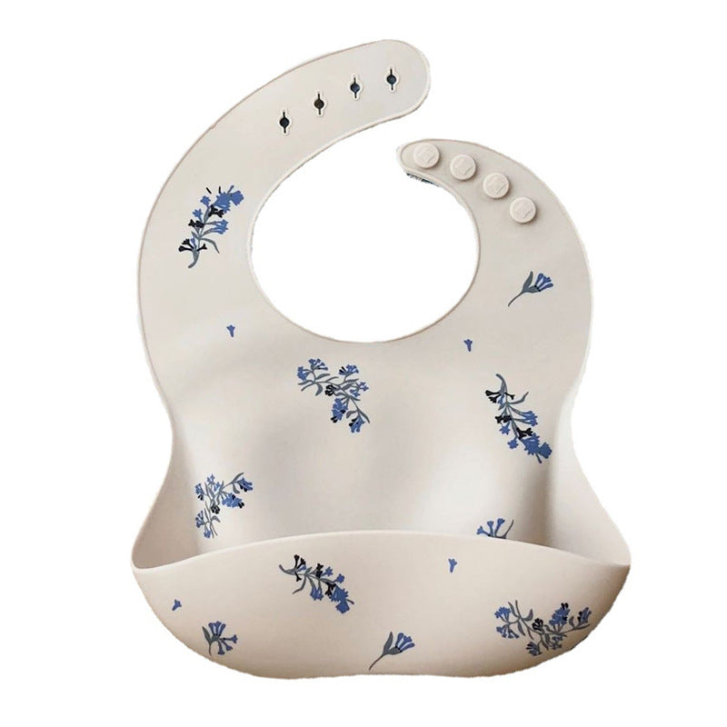 Mushie Silicone Baby Feeding Bib with Waterproof Food Catcher Pocket